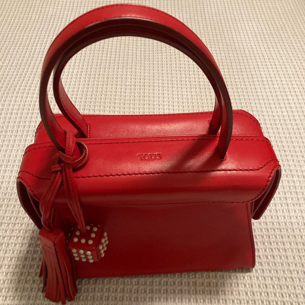 Tod’s red “dice” handbag